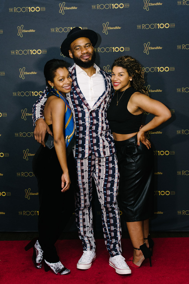 Terrell J. Starr (center) flanked by fellow GMG staffers.
